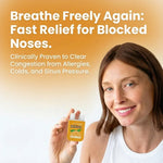 Smiling woman holding orange-scented Duo Chamber Double Release nasal spray for fast relief of blocked noses