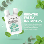 Aromi Naturals Mint nasal inhaler with dual chamber design and mint leaves on green background