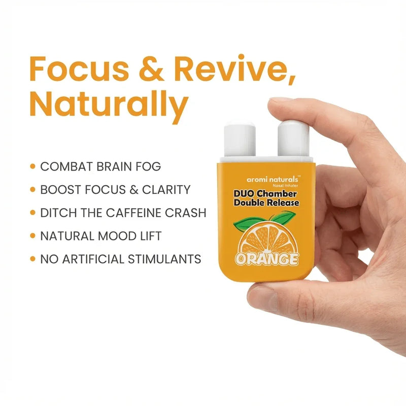 Hand holding Aromi Naturals Orange Duo Chamber nasal inhaler with focus and clarity benefits listed